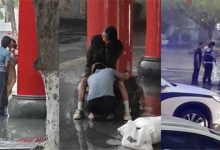 海南五指山廣場情侶雨中激情熱吻 性欲高漲時竟蹲下埋頭舔 最后被帽子叔叔們領走